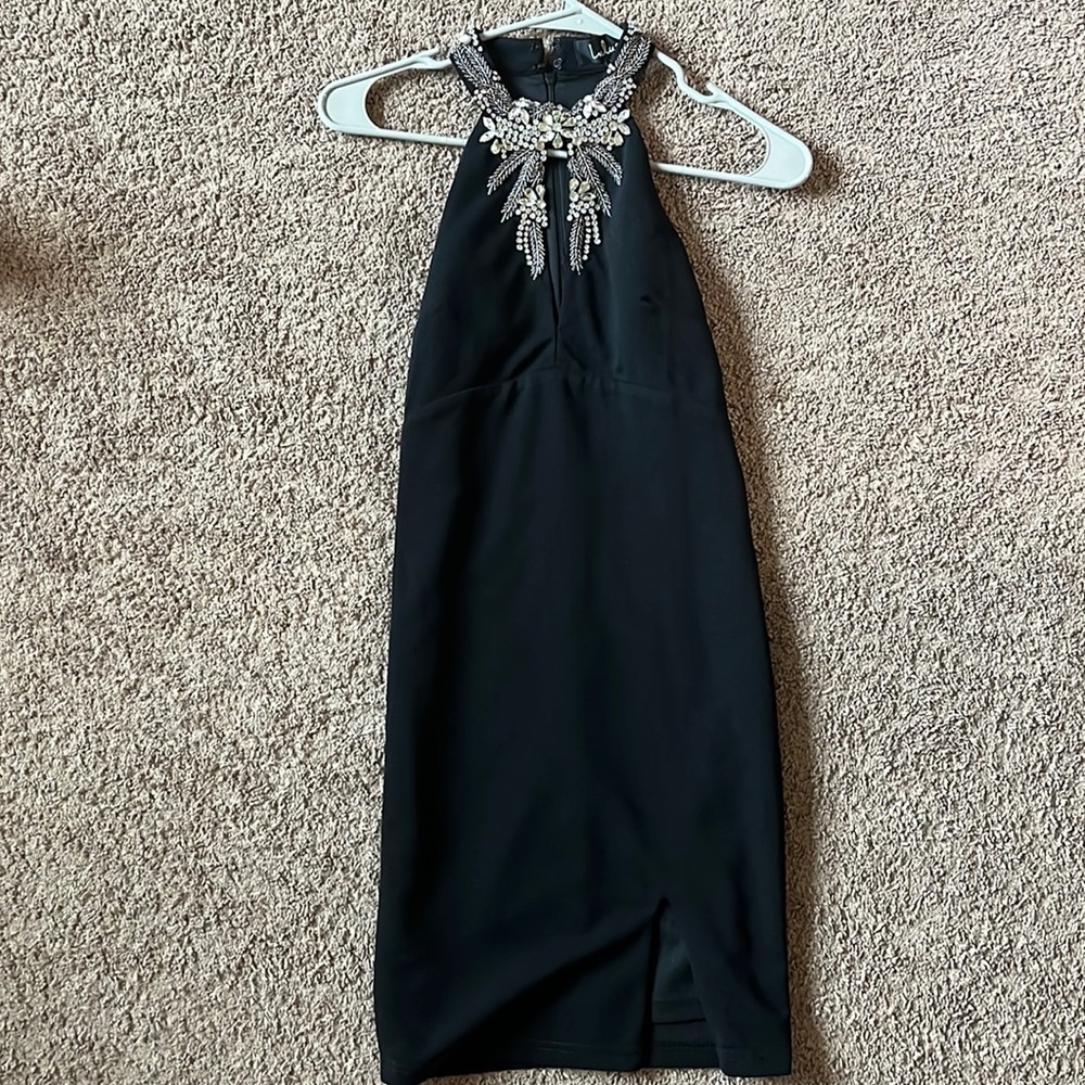 Tight Fighting Black Dress with Jew Accents with Slit on side